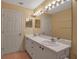 Double vanity bathroom with light beige walls at 3115 Live Oak Ln # 30, Palmetto, FL 34221