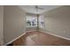 Bright bedroom with laminate wood flooring and window at 3115 Live Oak Ln # 30, Palmetto, FL 34221