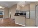 Open concept kitchen boasts granite counters and white appliances at 3115 Live Oak Ln # 30, Palmetto, FL 34221