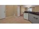 Galley kitchen with granite countertops and gray cabinets at 3115 Live Oak Ln # 30, Palmetto, FL 34221