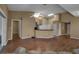 Spacious living area featuring hardwood floors and a kitchen bar at 3115 Live Oak Ln # 30, Palmetto, FL 34221