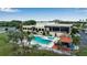 Community pool with clubhouse and patio at 3115 Live Oak Ln # 30, Palmetto, FL 34221