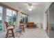 Relaxing sunroom featuring tiled floors, a ceiling fan and seating at 3115 Live Oak Ln # 30, Palmetto, FL 34221