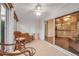 Bright sunroom with wicker furniture and view into the living area at 3115 Live Oak Ln # 30, Palmetto, FL 34221