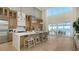 Modern kitchen with light wood cabinets and large island at 3460 Mistletoe Ln, Longboat Key, FL 34228