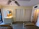 Bedroom with twin beds, dresser, and ample closet space at 3500 El Conquistador Pkwy # 331, Bradenton, FL 34210