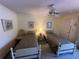Guest bedroom with twin beds and ceiling fan at 3500 El Conquistador Pkwy # 331, Bradenton, FL 34210