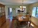 Dining area with wood table and access to kitchen at 3500 El Conquistador Pkwy # 331, Bradenton, FL 34210