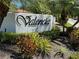Valencia community entrance sign with landscaping at 3500 El Conquistador Pkwy # 331, Bradenton, FL 34210