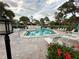 Community pool with ample deck space and lounge chairs at 3500 El Conquistador Pkwy # 331, Bradenton, FL 34210
