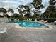 Inviting community pool area with plenty of seating at 3500 El Conquistador Pkwy # 331, Bradenton, FL 34210