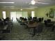 Community dining room with tables and chairs for residents at 3820 Ironwood Ln # 106-I, Bradenton, FL 34209