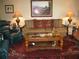 Relaxing living room with hardwood floors and a large sofa at 3820 Ironwood Ln # 106-I, Bradenton, FL 34209