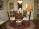 Charming dining room with a round table and four chairs at 3820 Ironwood Ln # 106-I, Bradenton, FL 34209