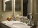Bathroom with marble vanity and modern fixtures at 3820 Ironwood Ln # 106-I, Bradenton, FL 34209