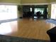 Spacious community room with hardwood floors and large windows at 3820 Ironwood Ln # 106-I, Bradenton, FL 34209
