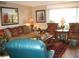 Comfortable living room with a large sofa and two armchairs at 3820 Ironwood Ln # 106-I, Bradenton, FL 34209