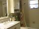 Clean bathroom with bathtub and floral shower curtain at 3820 Ironwood Ln # 106-I, Bradenton, FL 34209