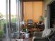 Sunroom with large windows and view of backyard at 3820 Ironwood Ln # 106-I, Bradenton, FL 34209
