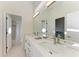 Double vanity bathroom with modern finishes at 4245 Hearthstone Dr, Sarasota, FL 34238