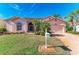 Attractive single-story home, featuring a large driveway and neat landscaping at 4245 Hearthstone Dr, Sarasota, FL 34238