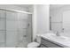 Bathroom with gray vanity, marble countertop, and a glass shower at 5058 Granite Dust Pl, Palmetto, FL 34221