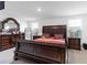 Bright bedroom with large bed and two nightstands at 5058 Granite Dust Pl, Palmetto, FL 34221