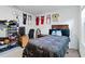 Small bedroom with a single bed, basketball jerseys on the wall and a computer desk at 5058 Granite Dust Pl, Palmetto, FL 34221