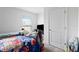 Small bedroom with double bed and closet at 5058 Granite Dust Pl, Palmetto, FL 34221