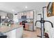 Modern kitchen with gray cabinets, granite countertops, and stainless steel appliances at 5058 Granite Dust Pl, Palmetto, FL 34221