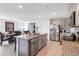 Island kitchen with granite countertops and stainless steel appliances at 5058 Granite Dust Pl, Palmetto, FL 34221