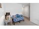 Sitting area with a patterned couch and a side table with lamp at 5058 Granite Dust Pl, Palmetto, FL 34221