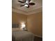 Bedroom with ceiling fan and soft lighting at 5242 Parisienne Pl # 201, Sarasota, FL 34238