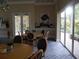 Bright community room with tables and chairs, access to patio at 5242 Parisienne Pl # 201, Sarasota, FL 34238