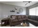 Spacious living room featuring a comfortable sectional sofa and a large flat-screen TV at 6079 Coral Way, Bradenton, FL 34207