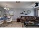 Living room with sectional sofa and glass coffee table at 6079 Coral Way, Bradenton, FL 34207