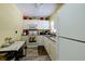 Well-equipped kitchen with white cabinets and modern appliances at 6079 Coral Way, Bradenton, FL 34207