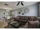 Open concept living and dining area with a comfortable sectional sofa at 6079 Coral Way, Bradenton, FL 34207