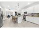 Spacious kitchen with island, stainless steel appliances, and white cabinetry at 6546 Rosehill Farm Run, Lakewood Ranch, FL 34211