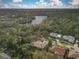 Community overview featuring houses and a lake at 8047 Desoto Woods Dr, Sarasota, FL 34243