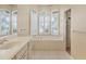 Bathroom features a large soaking tub, double sinks and walk in shower at 8047 Desoto Woods Dr, Sarasota, FL 34243