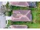 Aerial view of single-Gathering home with tile roof, landscaping, and driveway at 8115 Stirling Falls Cir, Sarasota, FL 34243