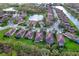 Aerial view of Lakridge Falls community, showcasing homes, landscaping, and a lake at 8115 Stirling Falls Cir, Sarasota, FL 34243