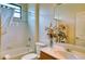 Clean bathroom with a bathtub, toilet and vanity at 8115 Stirling Falls Cir, Sarasota, FL 34243