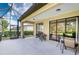 Large screened patio with plenty of seating at 8115 Stirling Falls Cir, Sarasota, FL 34243