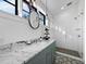 Modern bathroom with marble countertop and a large walk-in shower at 8413 9Th Nw Ave, Bradenton, FL 34209