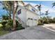 Attached two-car garage with modern design and exterior stairs at 8413 9Th Nw Ave, Bradenton, FL 34209