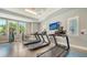 Modern cardio room featuring treadmills and other fitness equipment at 10105 Canaveral Cir, Sarasota, FL 34241