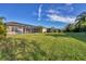 Large backyard with a view of the community, offering privacy and space at 12706 Lake Silver Ave, Bradenton, FL 34211