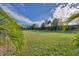 Expansive grassy backyard, providing ample space for recreation at 12706 Lake Silver Ave, Bradenton, FL 34211
